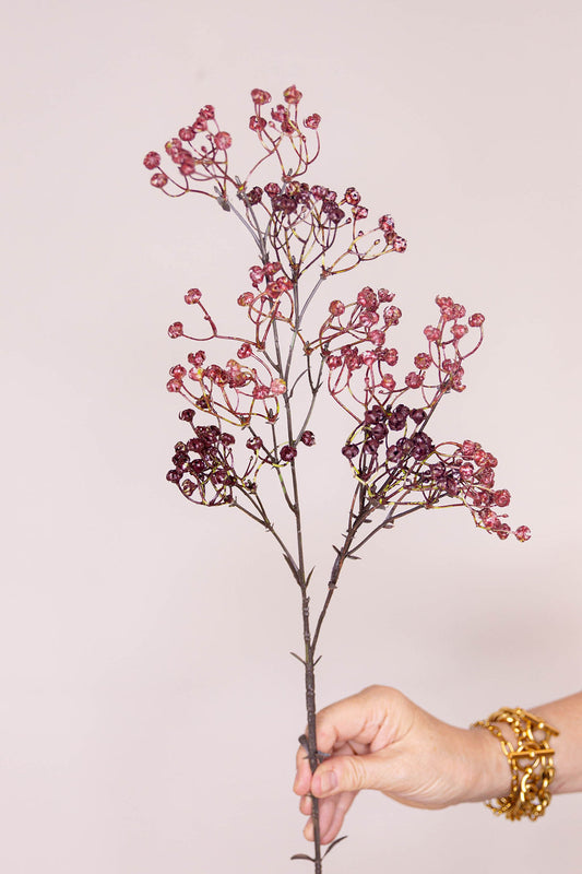 A faux floral Gypsophila stem with clusters of small burgundy berries.